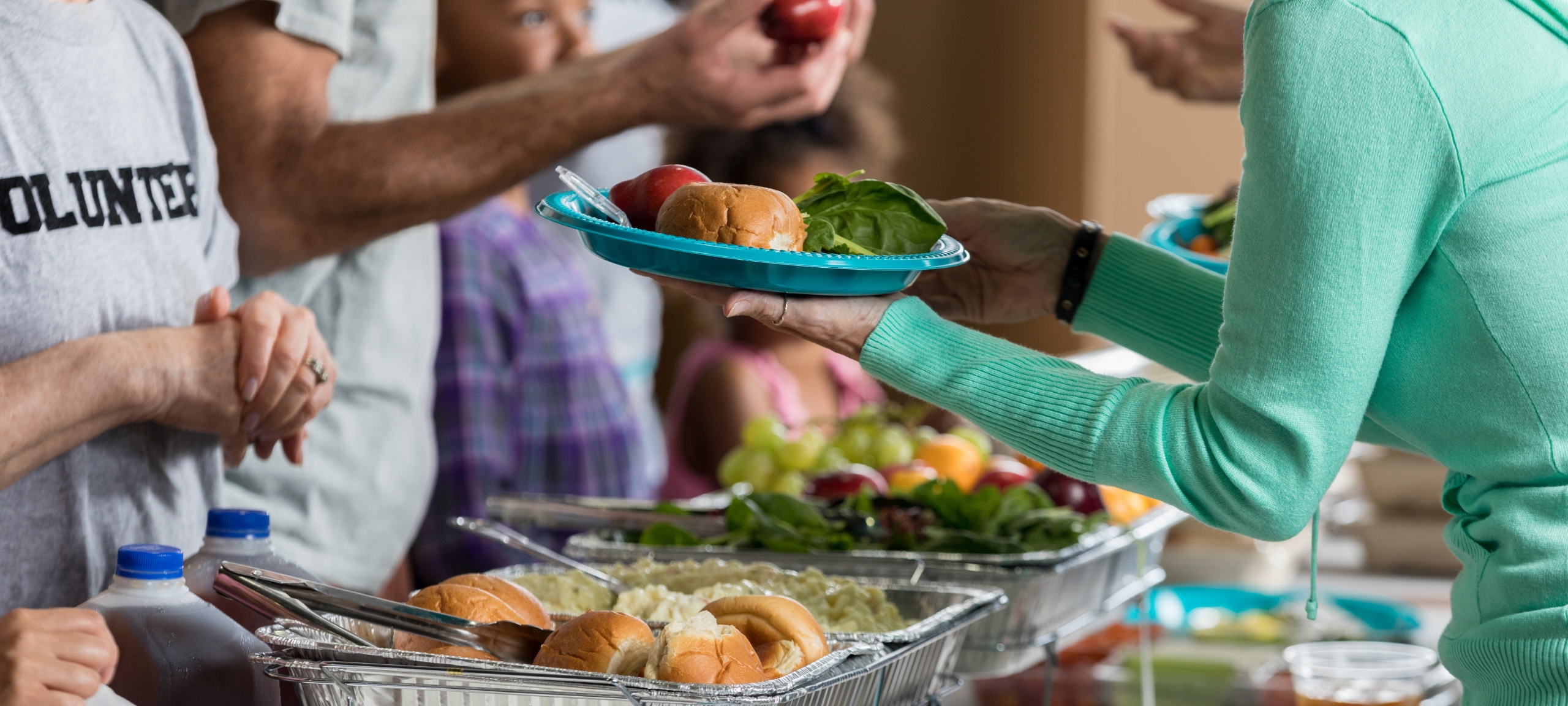 Homeless shelter serving a meal to the community